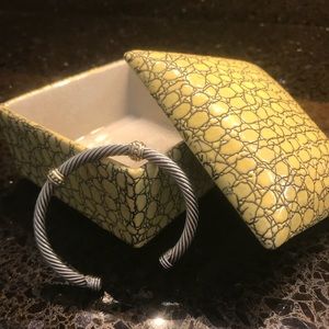 Silver detailed with gold. Medium size wrist